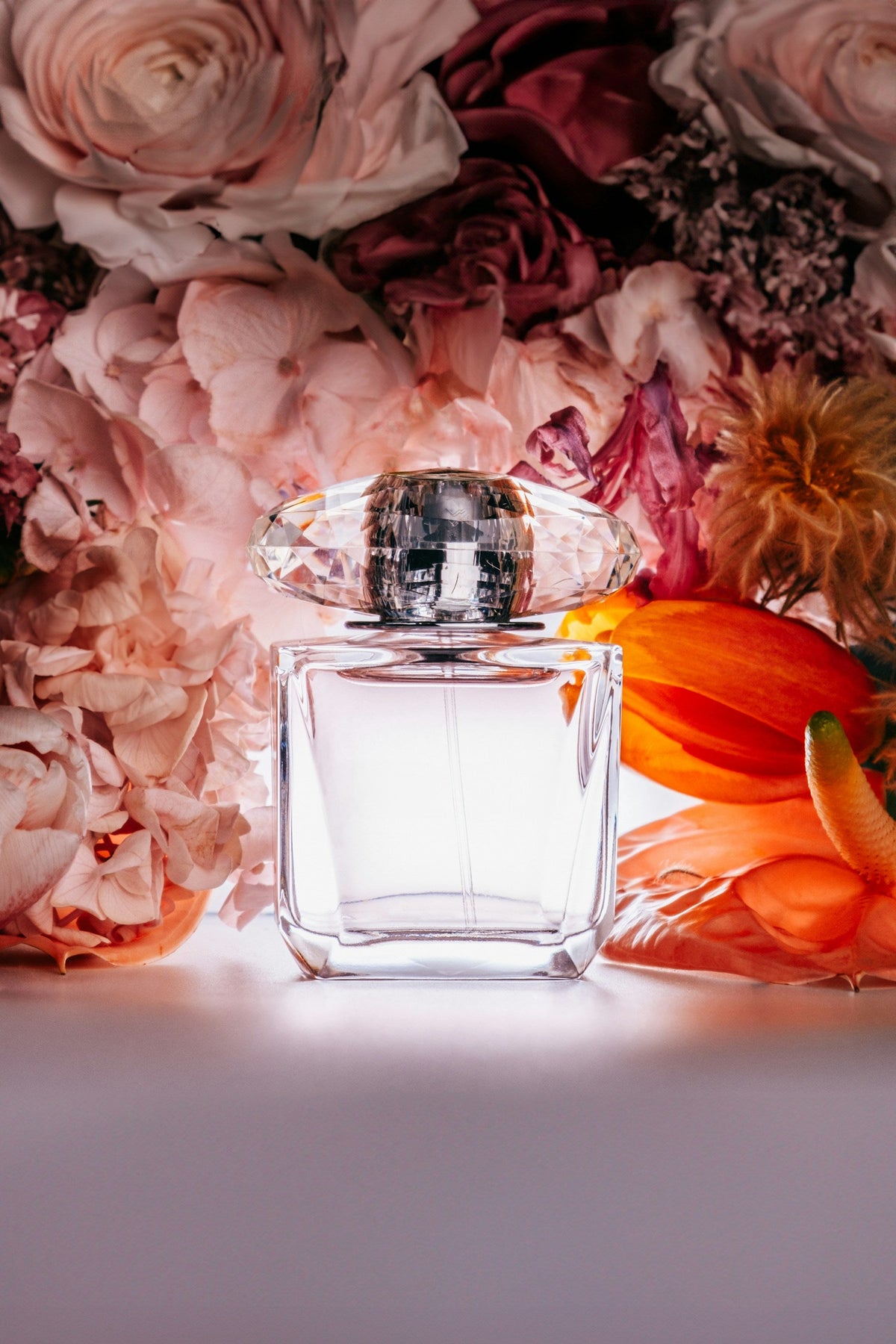Perfume and flowers in an editorial still life